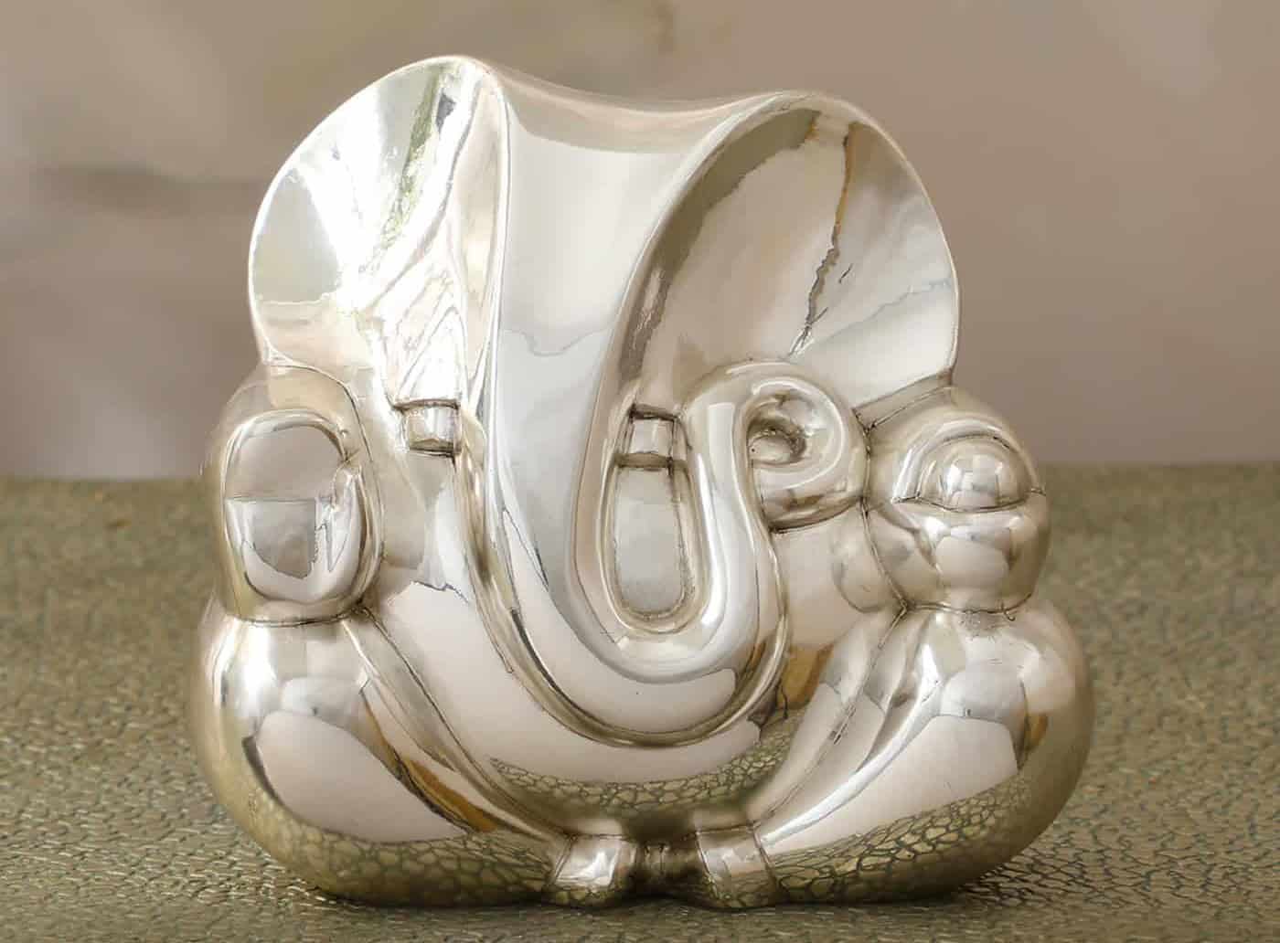 Explore Ideal Silver God Idol of Ganesha, remover of obstacles.